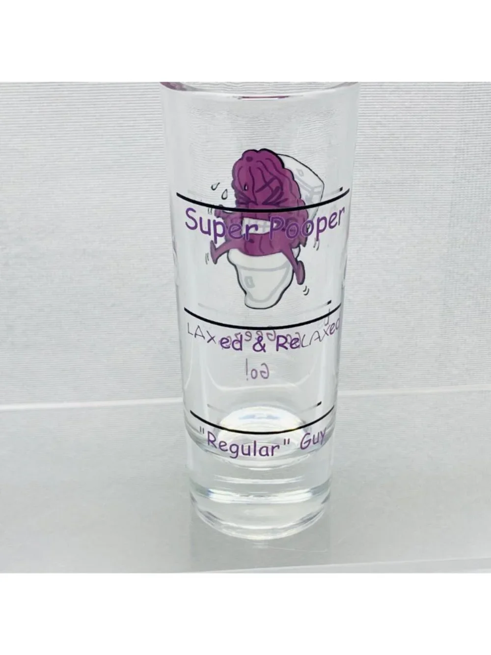 Super Pooper Shot Glass With Purple Prune Cartoon  Funny 